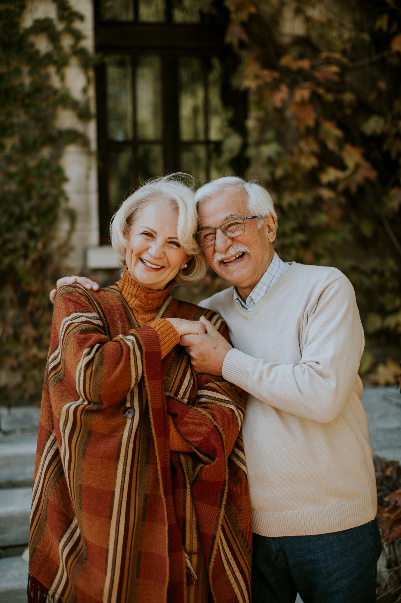 Senior couple embracing in autumn park