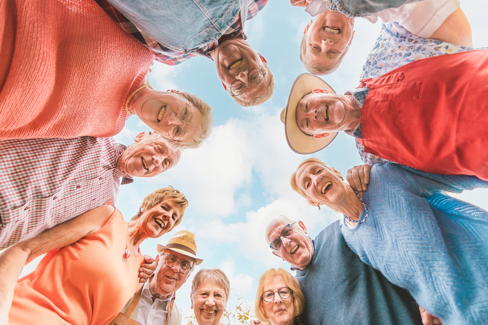 senior people having fun - bottom view of happy older people in a circle